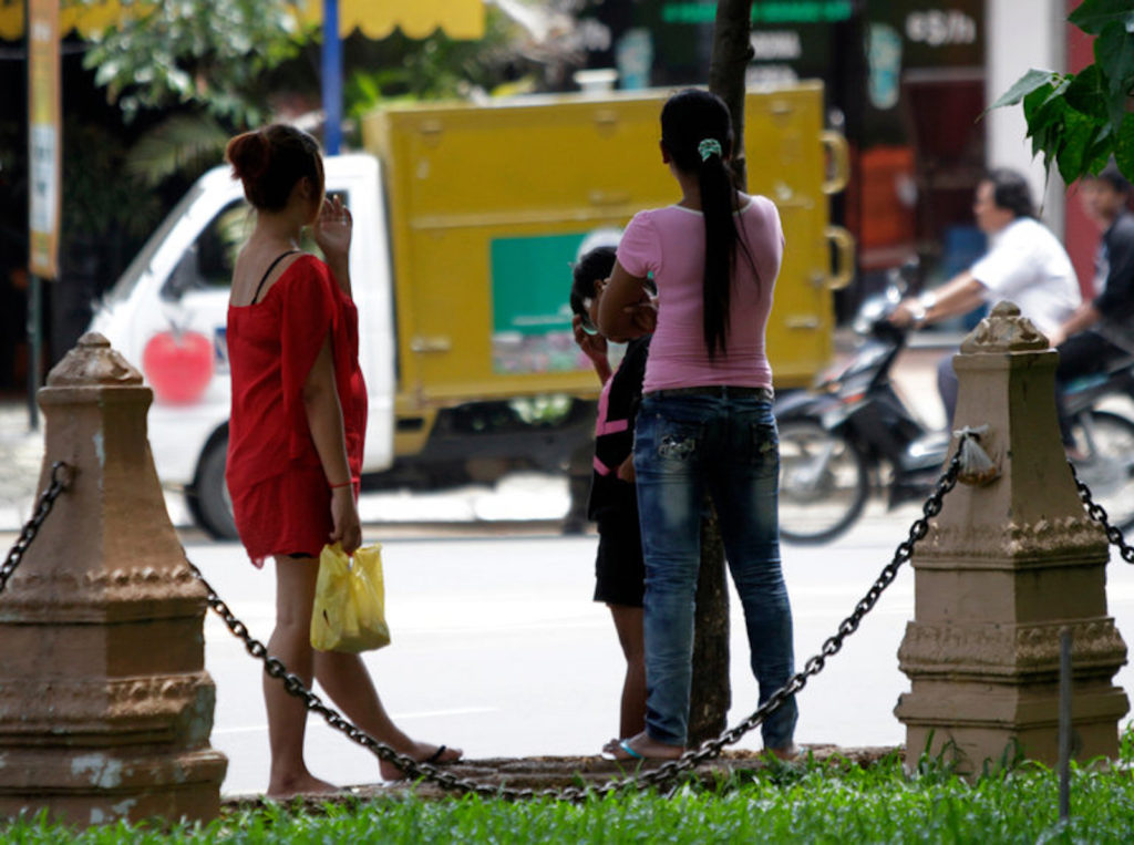 Cambodian sex workers waiting for customers at a public park in Phnom Penh.Credit Chor Sokunthea/Reuters